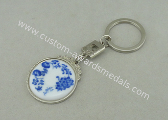 Porcelana azul/branca da porta-chaves relativa à promoção do chapeamento de cromo introduziu a parte